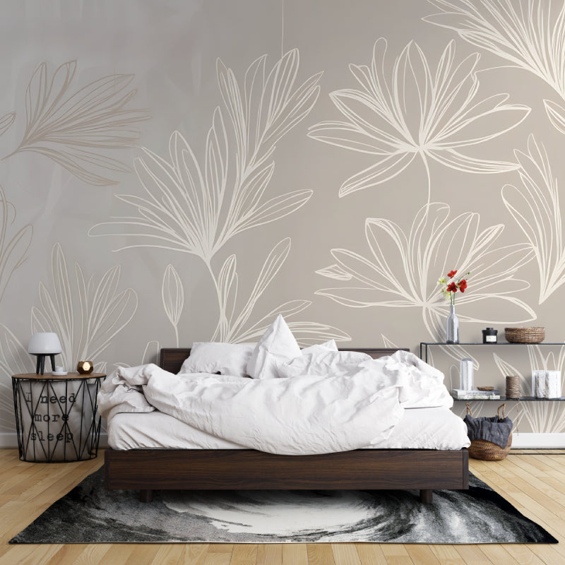 Minimalist tropical leaf wallpaper in bedroom creating calm atmosphere