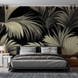 Tropical palm leaves wallpaper in black and beige creating a stunning accent wall in a modern living room with natural light