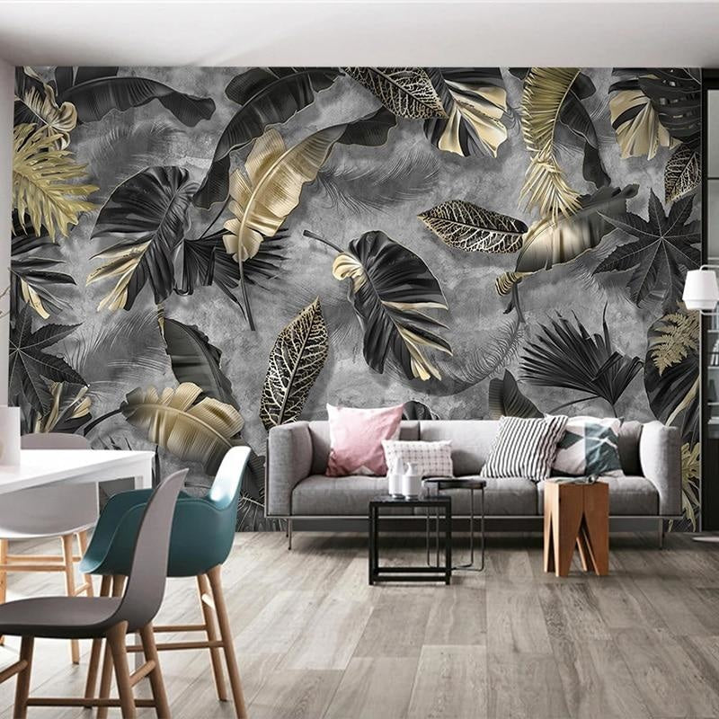Tropical black and gold leaf wallpaper in modern living room with dark furniture and ambient lighting