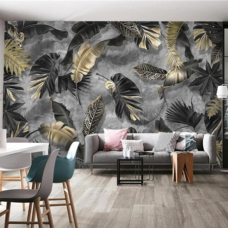 Tropical black and gold leaf wallpaper in modern living room with dark furniture and ambient lighting