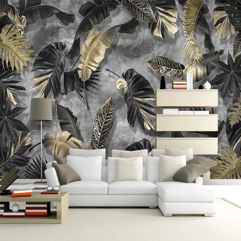 Luxury hotel lobby showcasing dramatic tropical leaf mural in black and gold