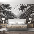 Black and white tropical jungle wallpaper creating depth in a modern living room with clean furniture and natural light