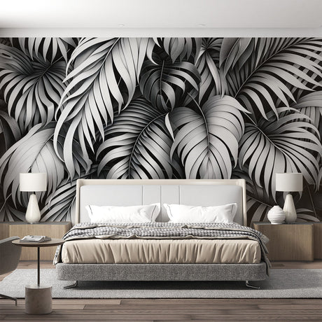 Black and white Monstera leaf wallpaper creating dramatic contrast in modern living room with minimalist furniture