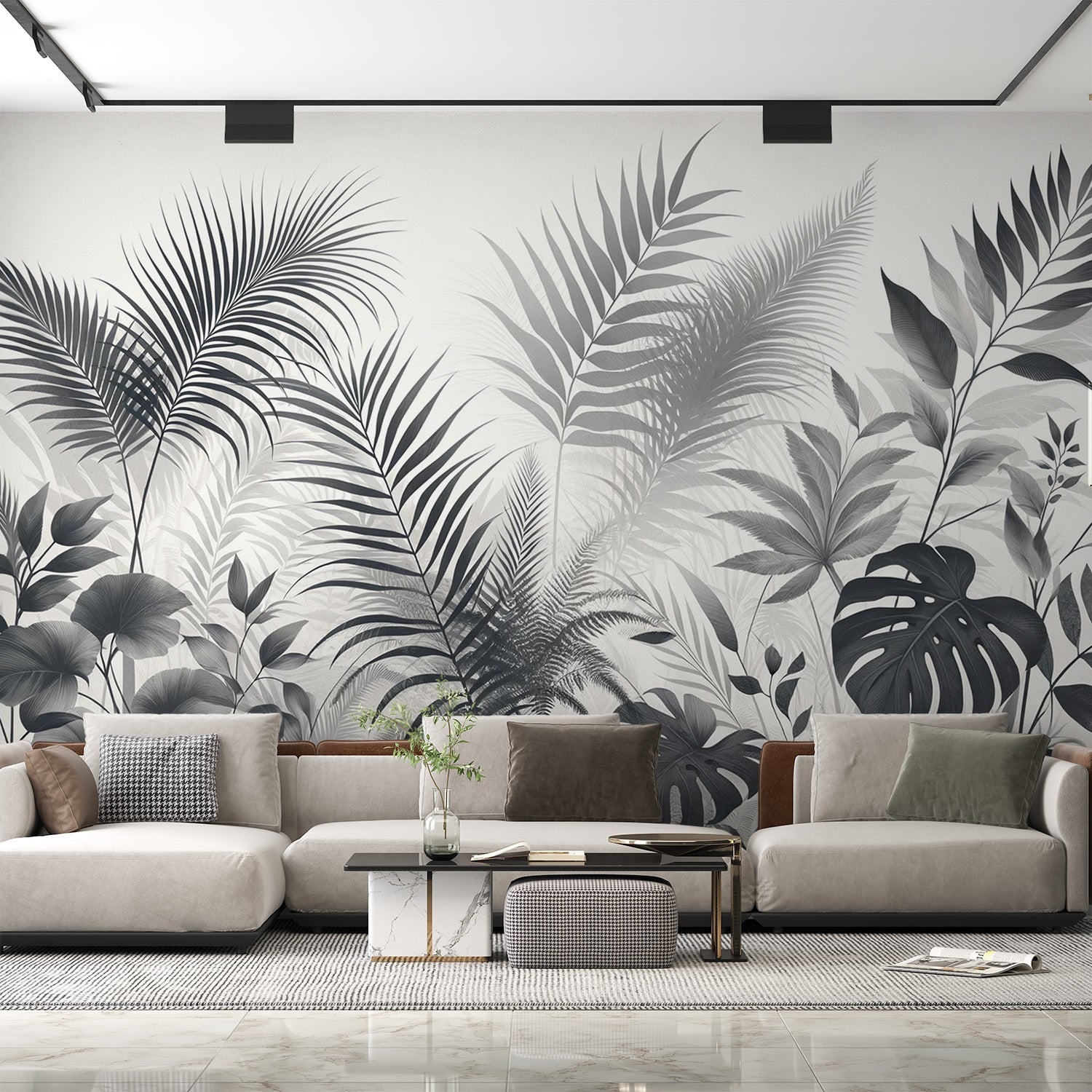 Black and white tropical leaf wallpaper creates drama in modern living room with gray sofa and natural light