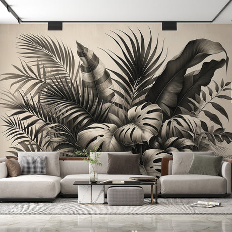 Black and white tropical wallpaper with monstera leaves creating drama in a modern living room with minimal furniture