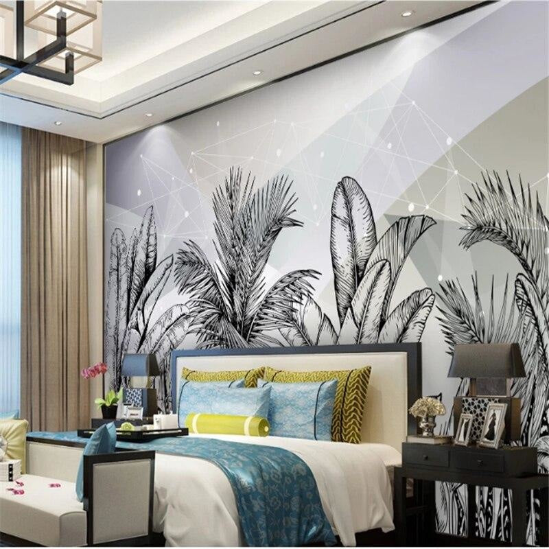 Monochrome palm leaves mural adding depth to a contemporary bedroom space