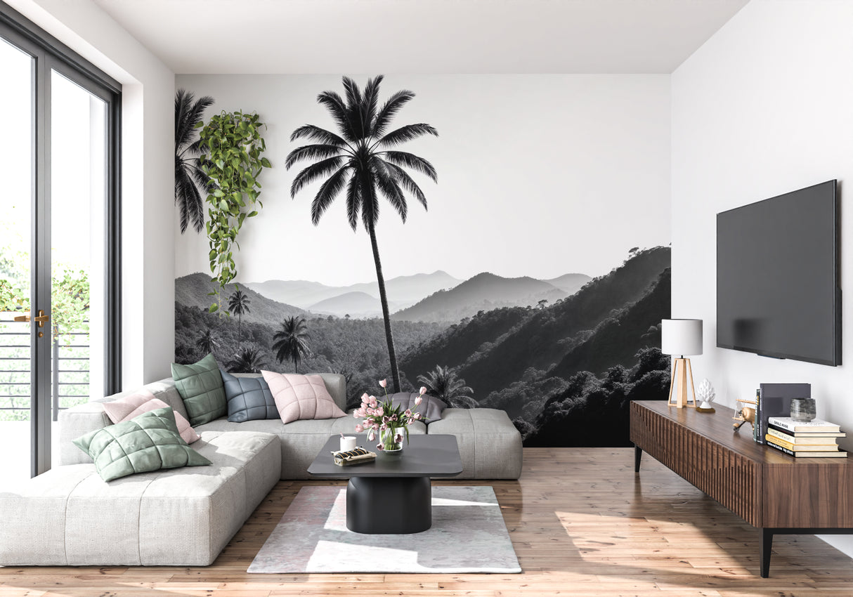 Black and white tropical palm wallpaper creating drama in modern living room setting