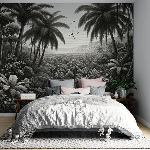 Black and white tropical palm wallpaper creating a dramatic statement wall in a modern living room with minimalist furniture