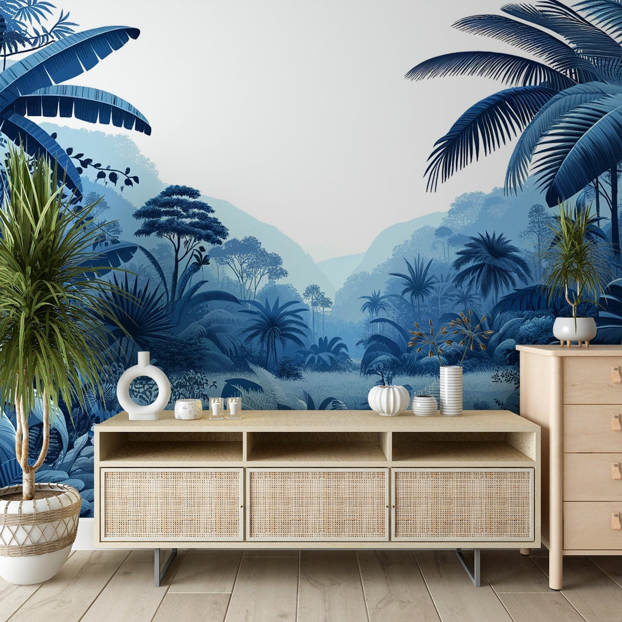 Blue tropical jungle wallpaper creating a dreamy atmosphere in a modern living room with white furniture