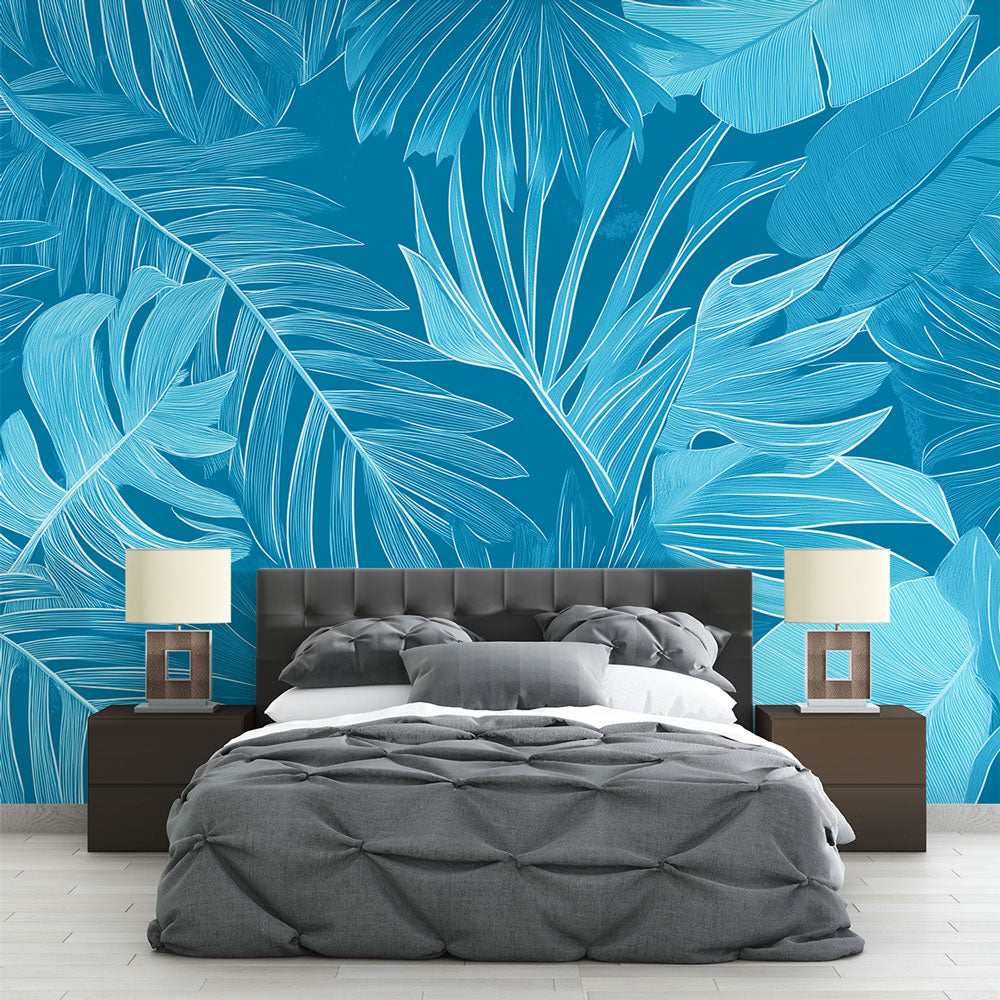Blue Monstera leaf wallpaper creating a peaceful atmosphere in a modern living room with natural light