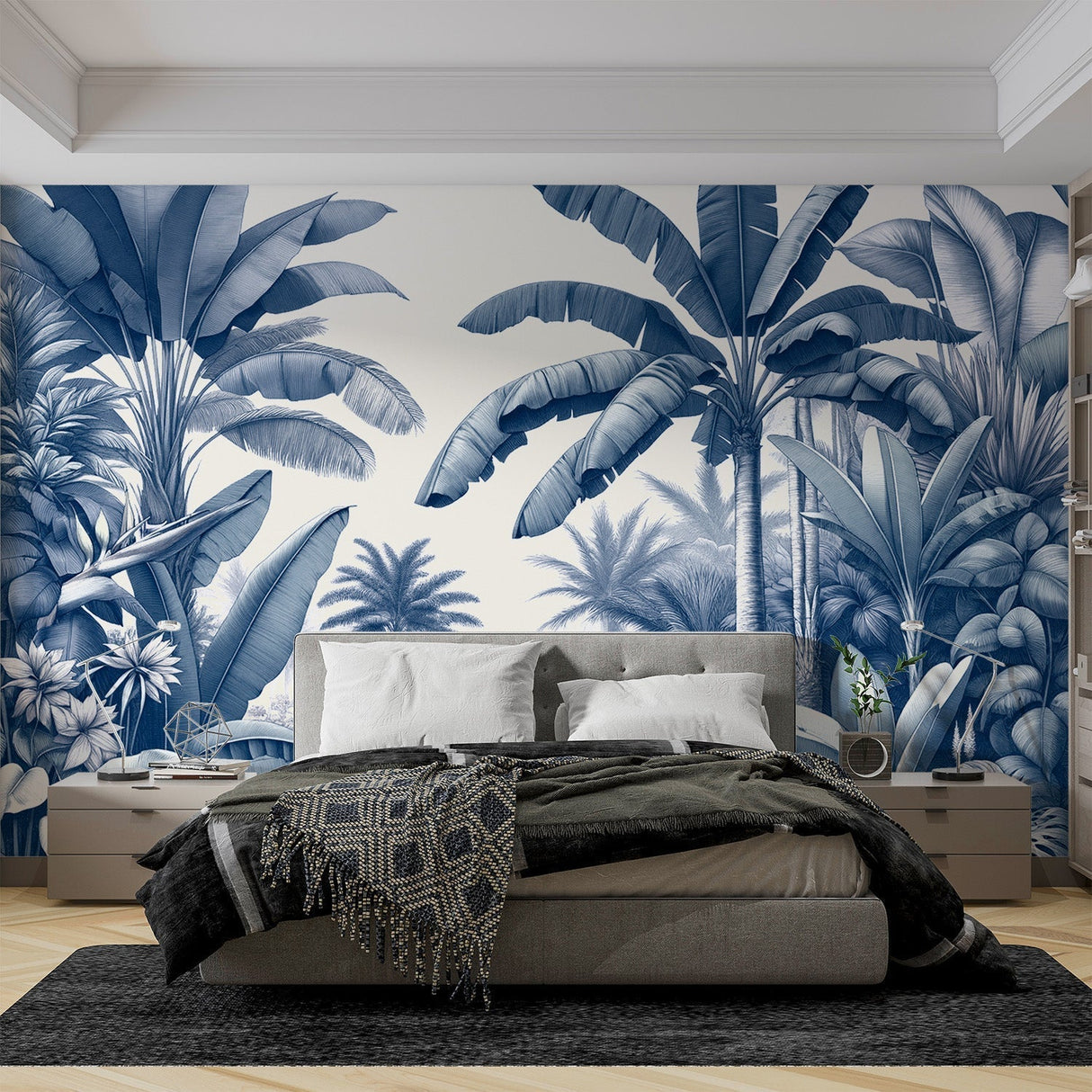 Blue palm leaves tropical wallpaper mural styled in a modern living room with white furniture and natural light
