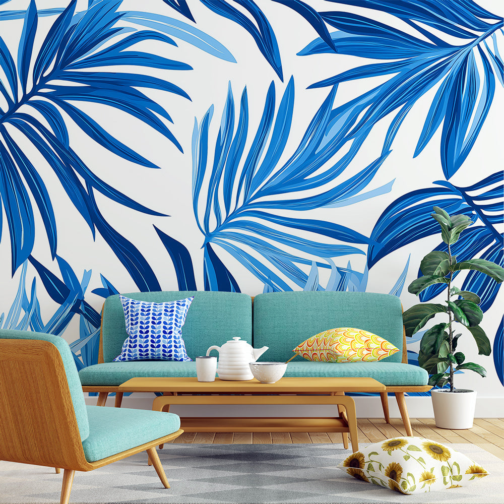 Blue Palm Leaves Wallpaper showcased in a bright modern living room, creating a fresh tropical atmosphere