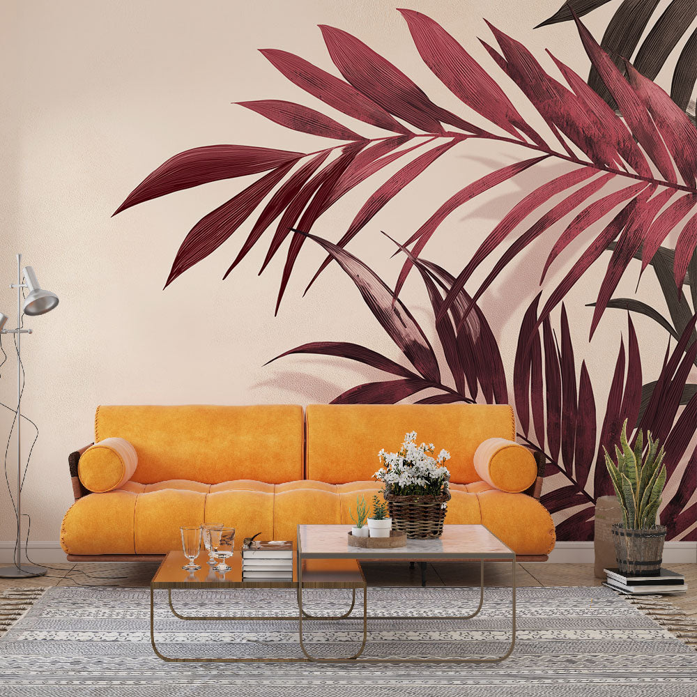 Burgundy palm leaf wallpaper in modern living room with natural light highlighting the rich wine-colored tropical pattern