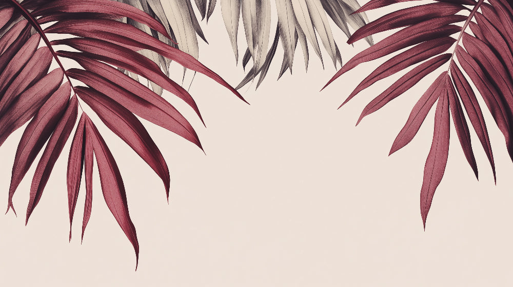 Burgundy palm leaf wallpaper mural creating a dramatic accent wall in a modern living room with natural light