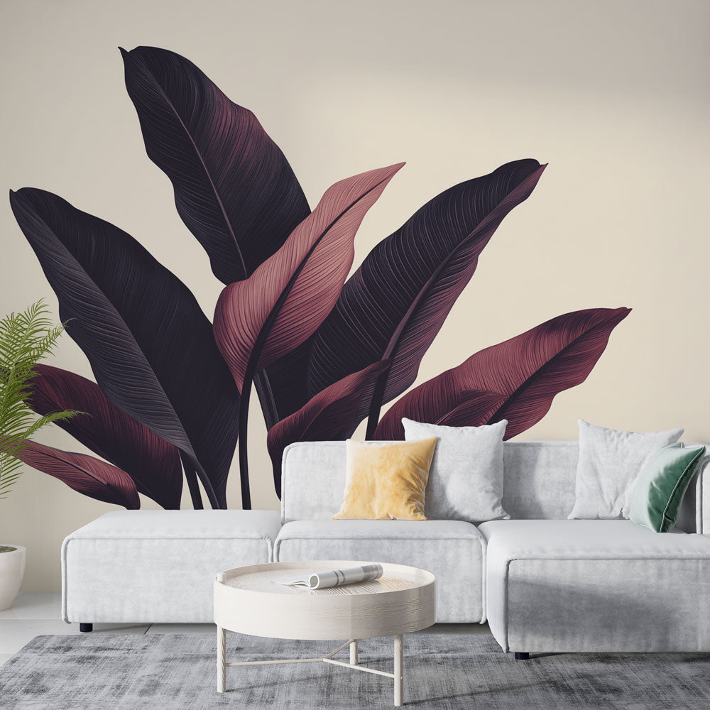 Tropical leaf wallpaper with burgundy foliage creating drama in a modern living room with grey furniture and natural light