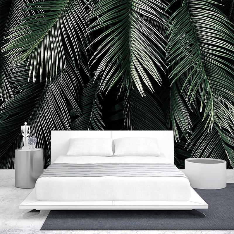 Dark green palm leaf mural in master bedroom creating jungle atmosphere
