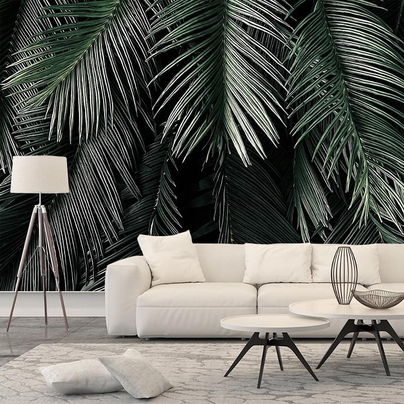 Botanical palm wallpaper in dining room with wooden furniture and plants