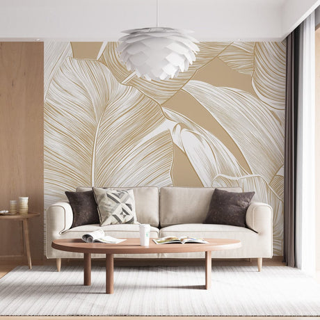 Tropical leaf wallpaper in modern living room showing white banana leaves on beige background creating fresh, airy atmosphere