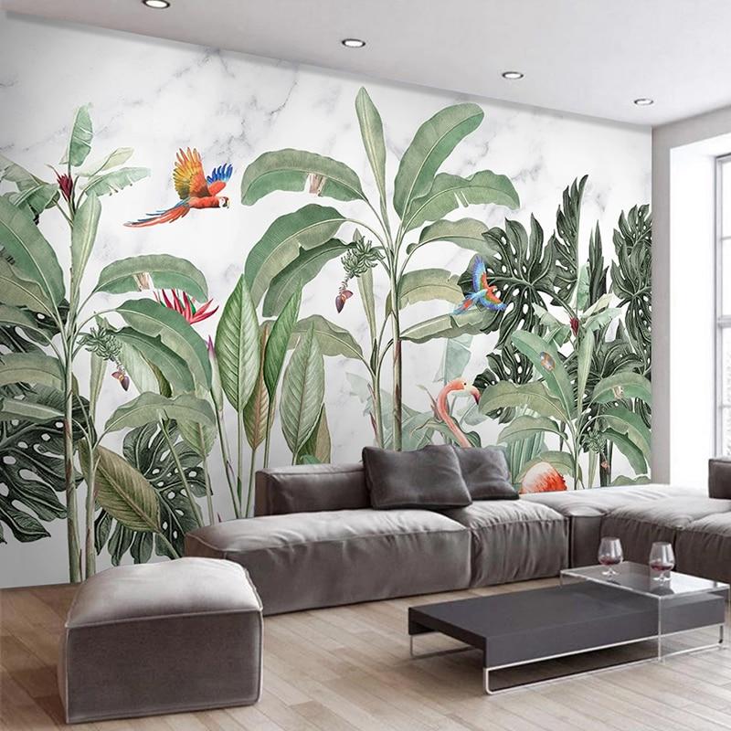 Paradise birds and banana leaves wallpaper in home office corner