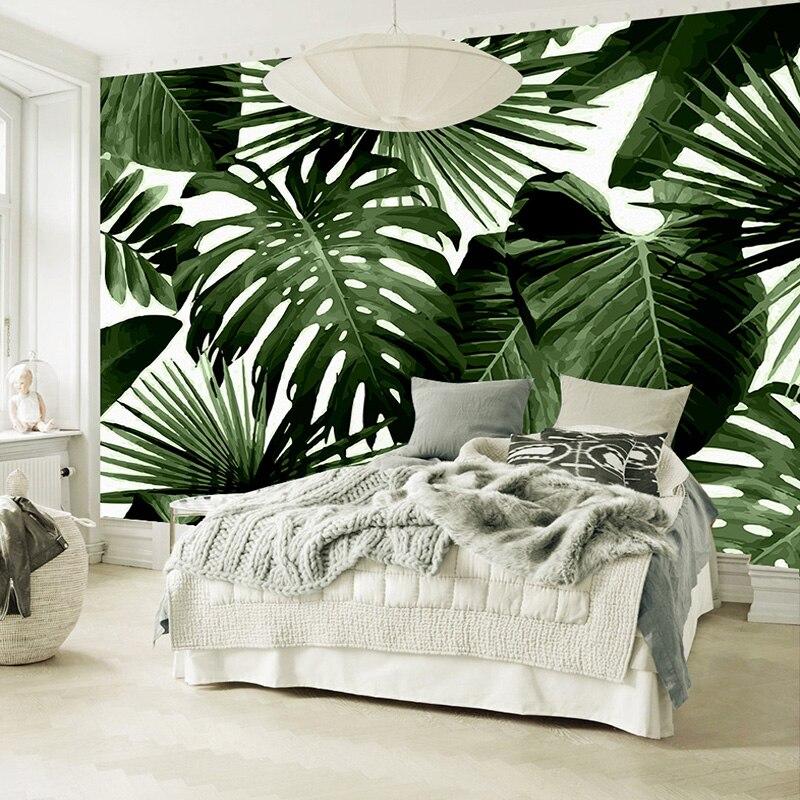Monstera wallpaper creating focal point in bright bedroom with natural lighting