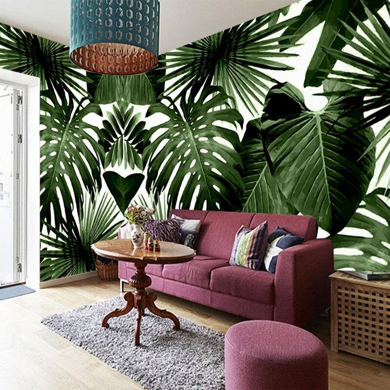 Botanical wall mural in home office with oversized palm leaves making statement