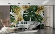 Tropical leaf wallpaper with gold and green monstera pattern in modern living room with natural light