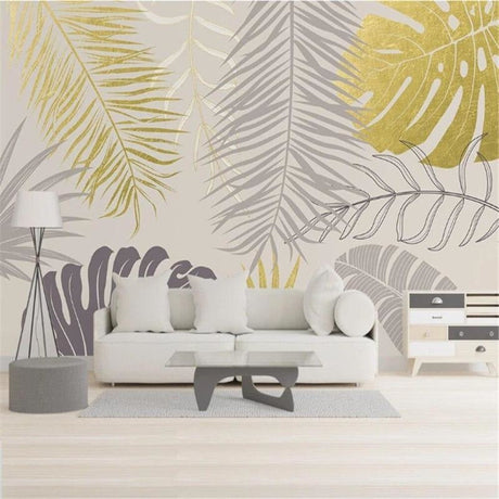 Tropical palm leaves wallpaper in gold and grey creating a luxurious atmosphere in a modern living room