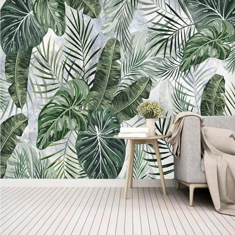 Monstera leaf wallpaper adding natural beauty to a minimalist dining room space