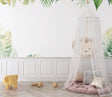 Tropical lion wallpaper creating a bold statement in modern living room with green monstera leaves