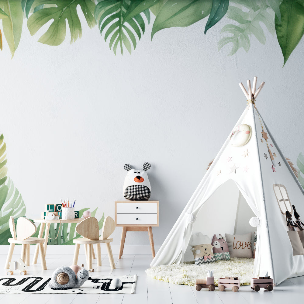 Playroom transformed with jungle theme lion wallpaper and monstera pattern