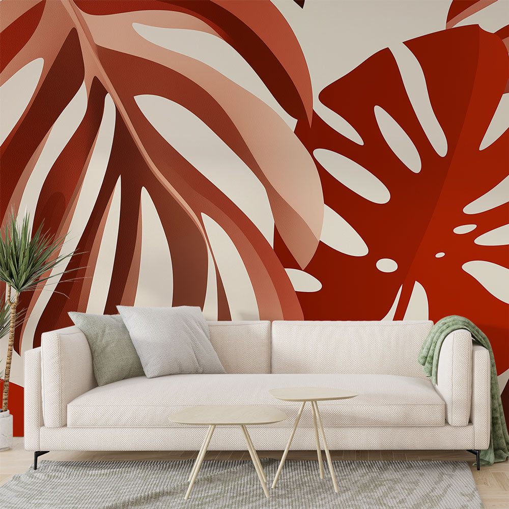 Modern Monstera leaf wallpaper in warm terracotta tones styled in a bright living room with minimal furniture