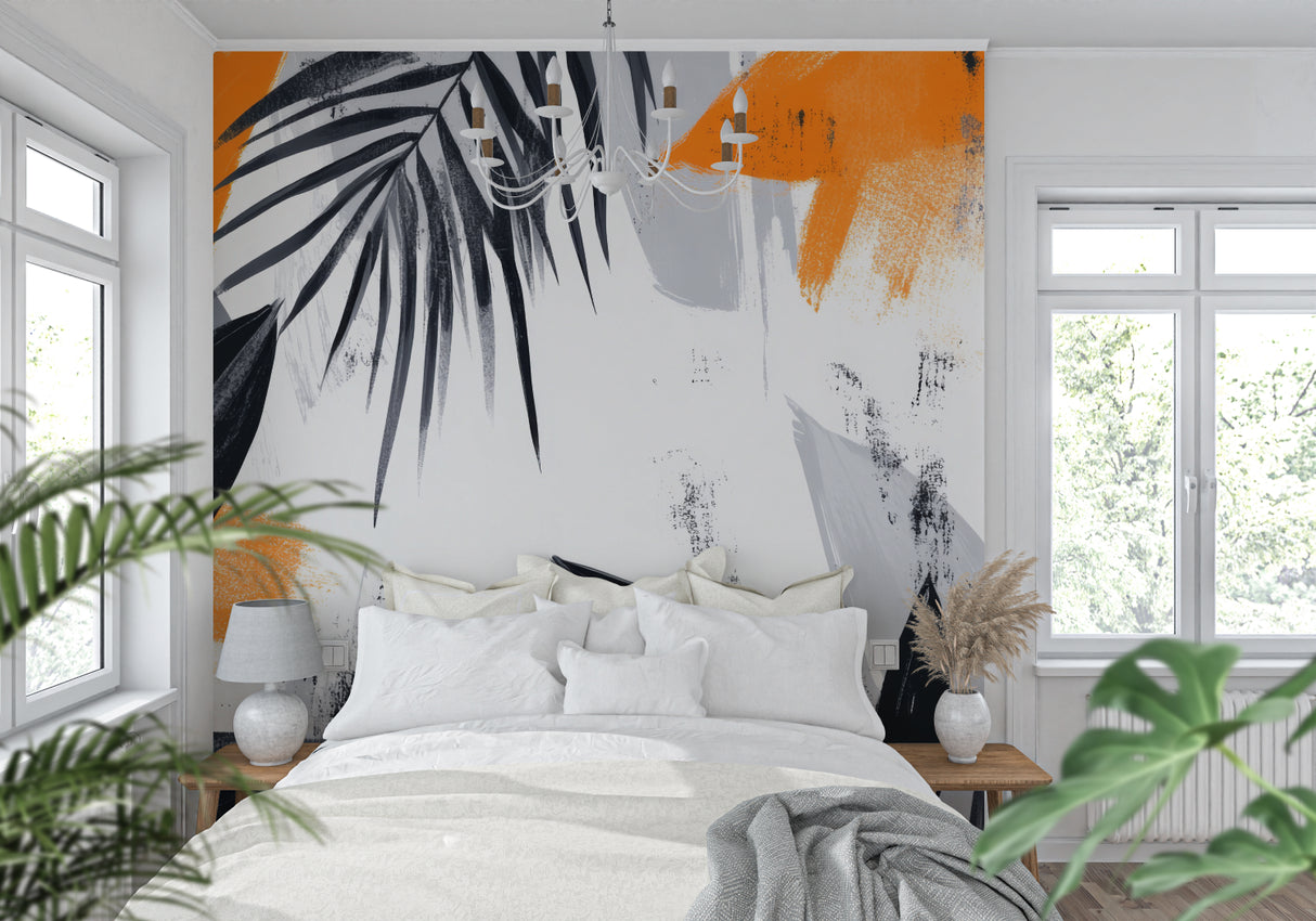 Home office with modern tropical wall mural showing black palm leaves and orange details