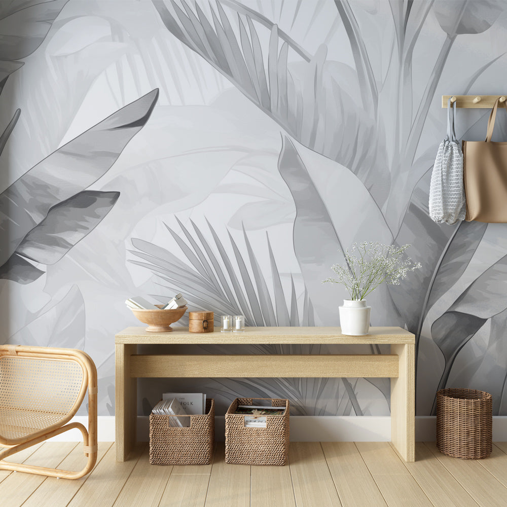 Tropical leaf wallpaper in modern gray living room, showing oversized palm and banana leaves creating depth and movement