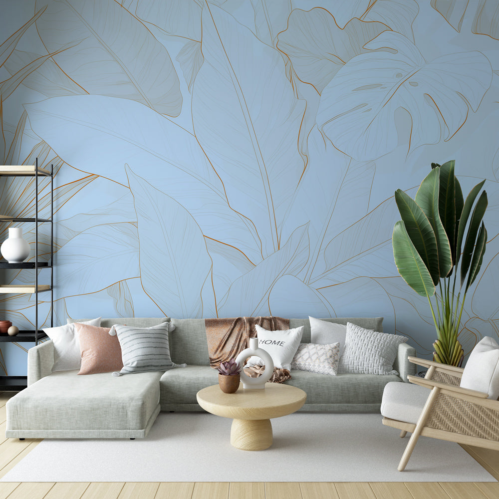 Tropical leaf wallpaper with gold monstera design creating a luxurious atmosphere in a modern living room