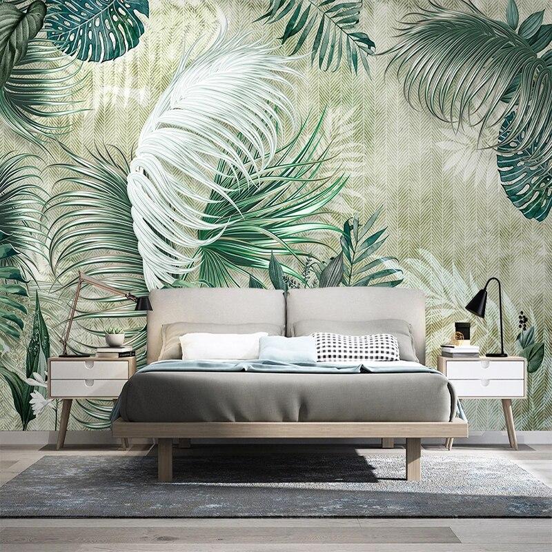 Dining room with botanical wallpaper showing monstera and palm leaf pattern