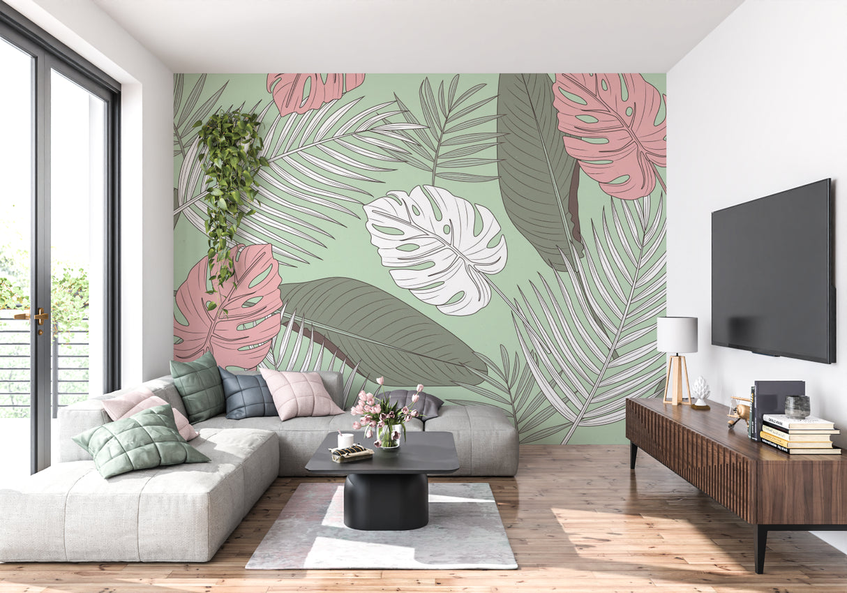 Modern home office featuring tropical leaf wallpaper in soft pink and sage