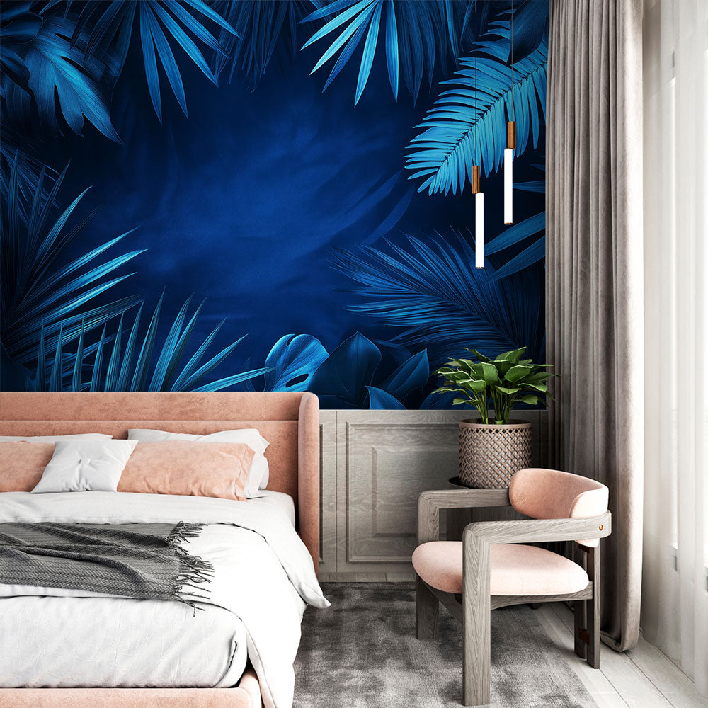Tropical blue palm leaves wallpaper creating a stunning accent wall in a modern living room with white furniture