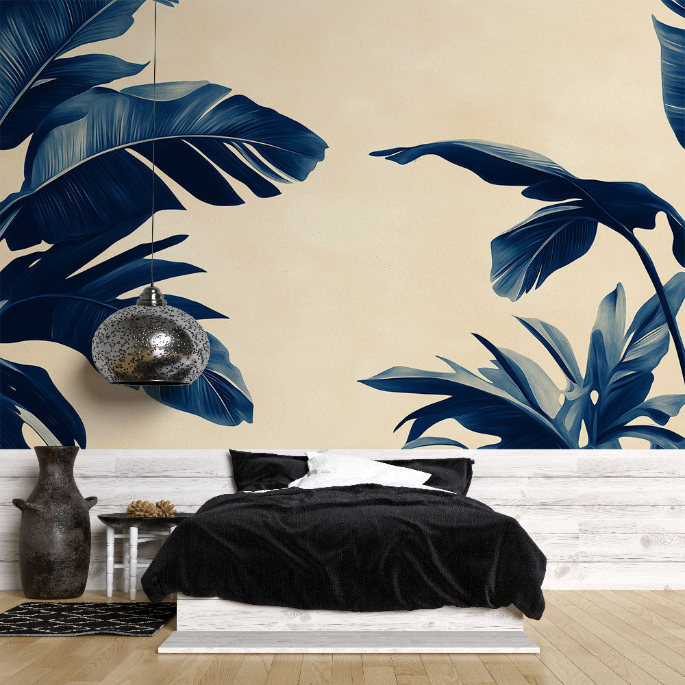 Tropical banana leaf wallpaper in navy blue creates a stunning accent wall in a modern living room with beige furniture