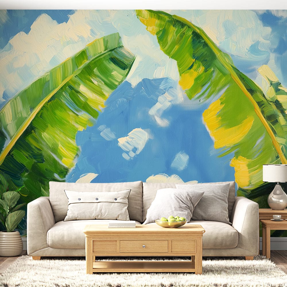 Tropical banana leaf wallpaper creating a fresh resort feel in a modern living room with white furniture and natural light