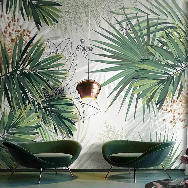 Palm leaves and butterfly wallpaper adding natural charm to a bright home office