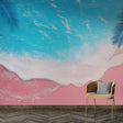 Tropical beach wallpaper with pink sand and palm leaves creating a dreamy atmosphere in a modern living room