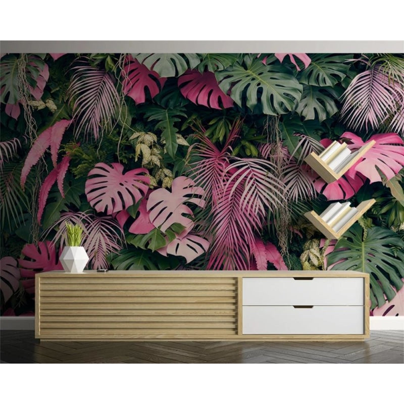 Tropical jungle wallpaper featuring pink monstera leaves in cozy bedroom setting