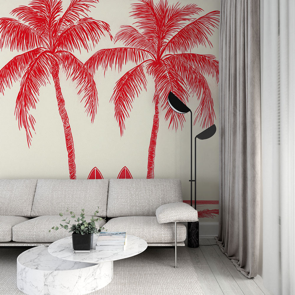 Tropical beach wallpaper with red palm trees and surfboards creating a modern vibe in a bright living room setting