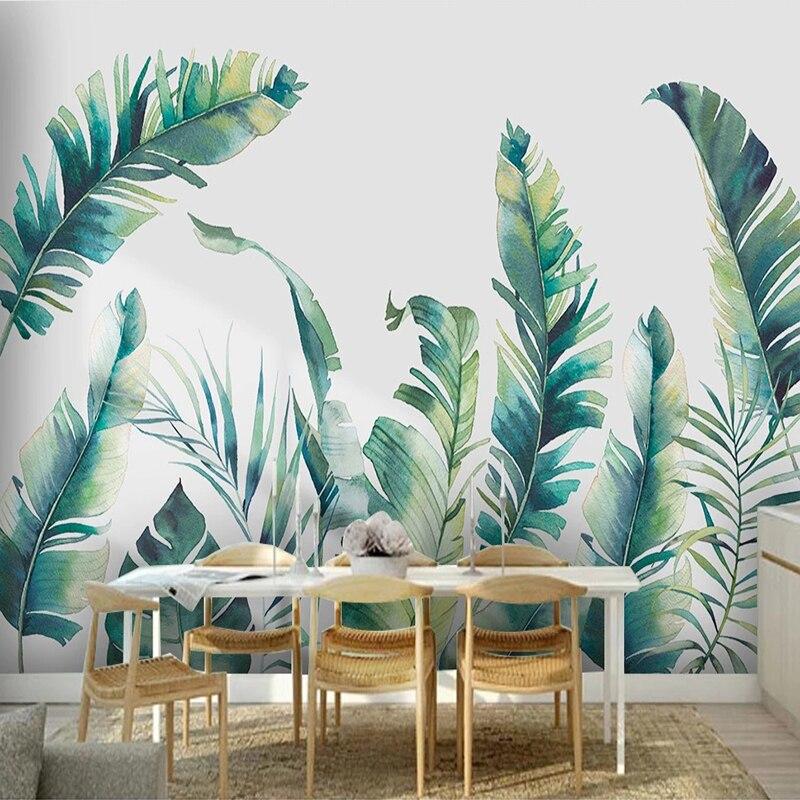 Tropical watercolor wallpaper in dining room showing scale of banana leaf pattern