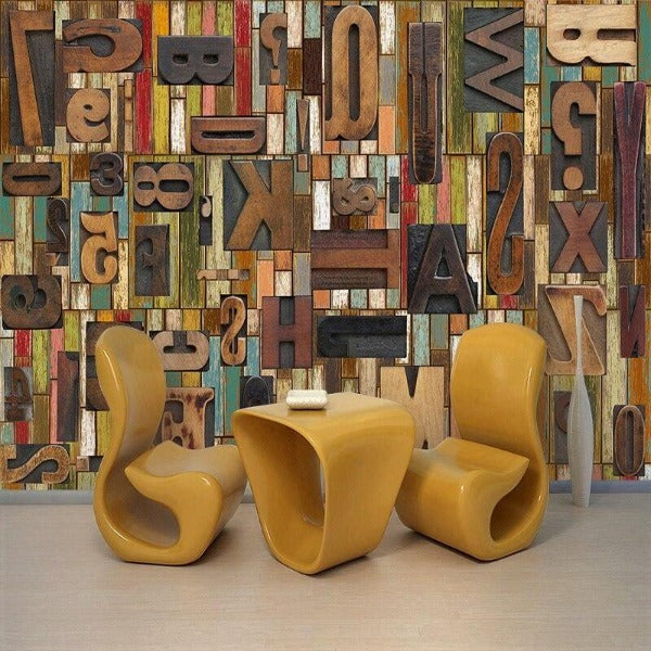 Typography wall mural bringing character to a modern home office with wooden letter prints against white furniture