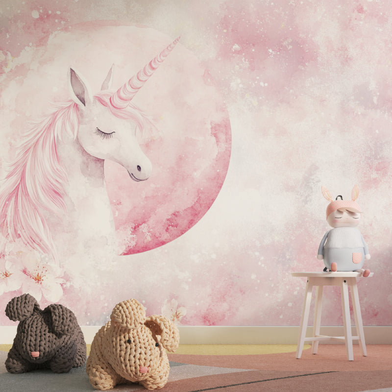 Magical unicorn wall mural in a baby girl's nursery with rocking chair
