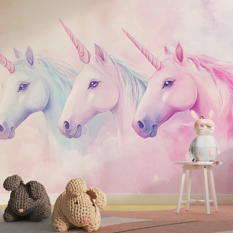 Pastel unicorn wall design in a playroom with reading nook