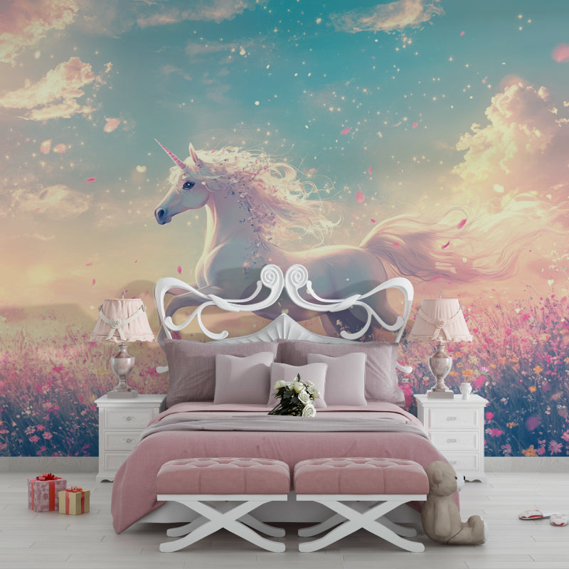 Pink floral unicorn mural creating magic in a nursery with white furniture