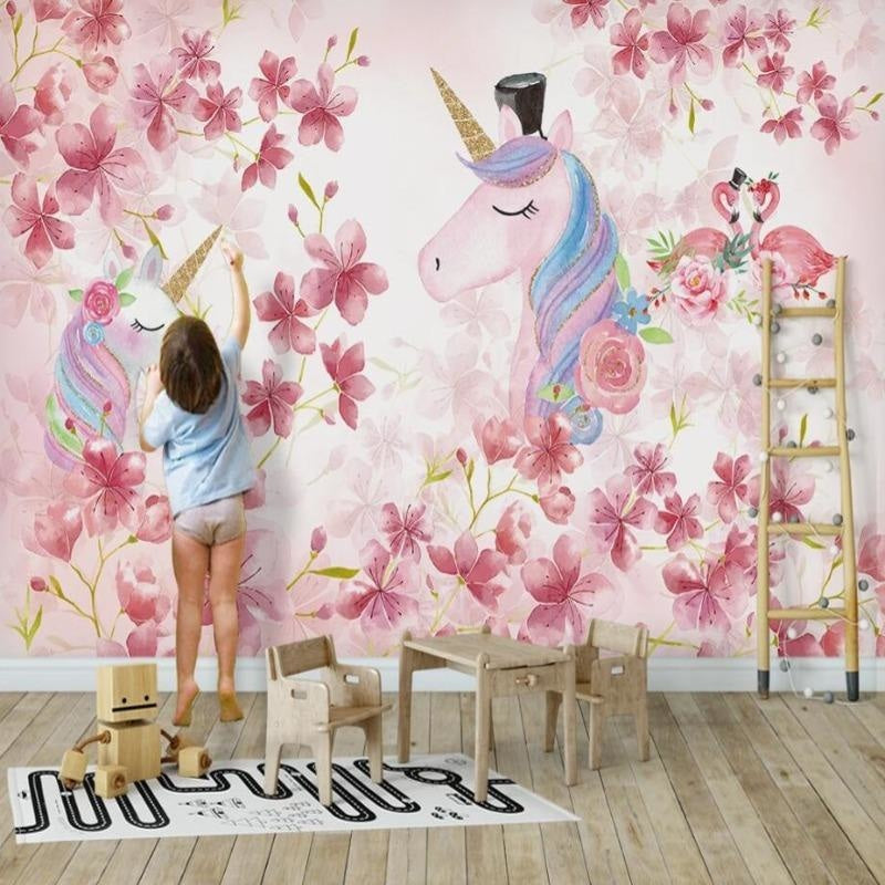 Unicorn wallpaper mural in a bright kids bedroom showing magical scene with cherry blossoms