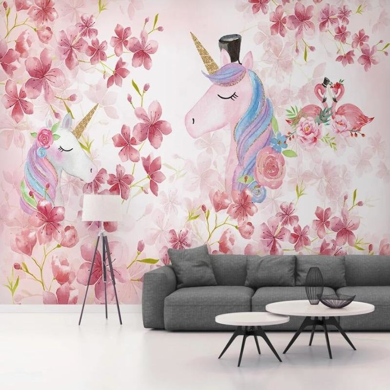 Pink unicorn wall mural creating dreamy atmosphere in nursery with soft lighting